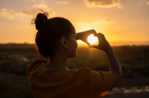 A woman enjoying the sun and living a joyful life.